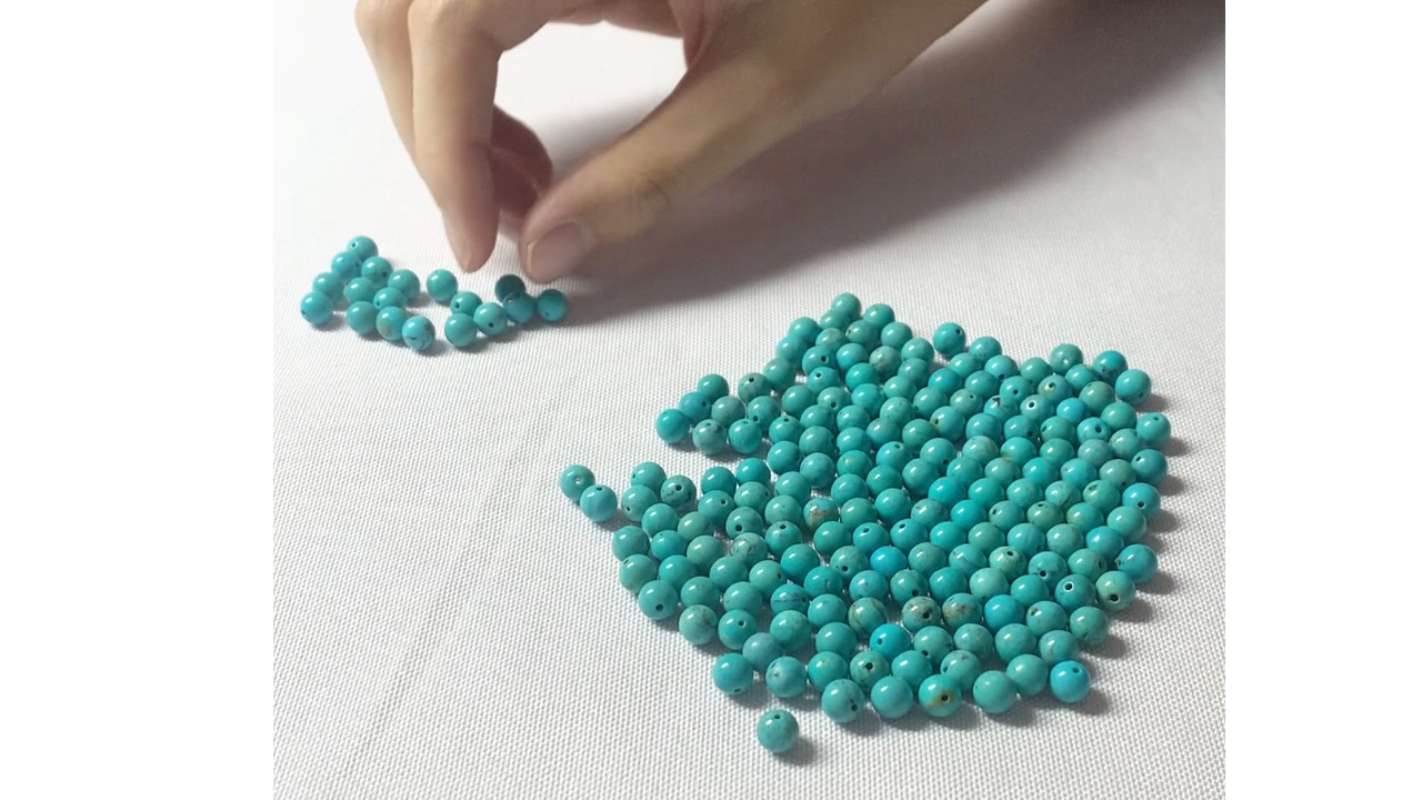 Hand sorting round Turquoise beads 12
