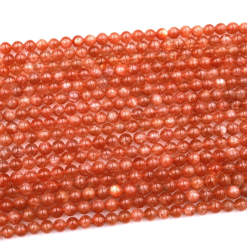 تەبىئىي قۇياش تېشى يۇمىلاق مونچاق Feldspar ئالتۇن پارقىراق ئاپېلسىن قىزىل گۆھەر تاش 17