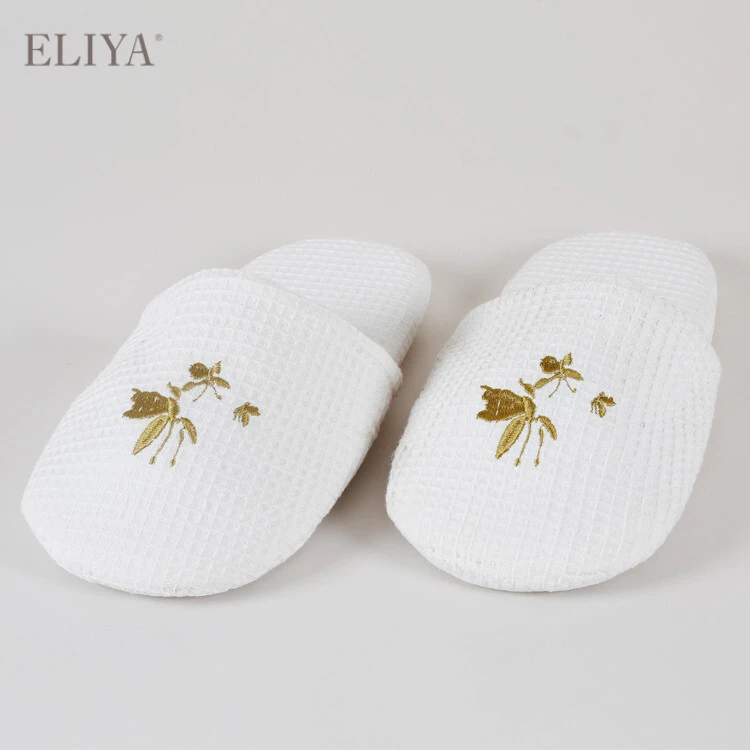 Wholesale White EVA Disposable Hotel Slipper With Embroidered Logo 1