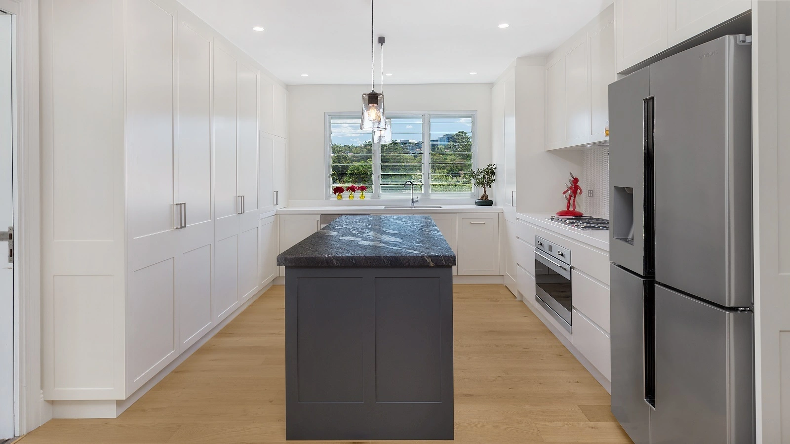 AllandCabinet Shaker Kitchen Cabinet in a Polyurethane Finish with a Cosmic Black Granite Benchtop 1