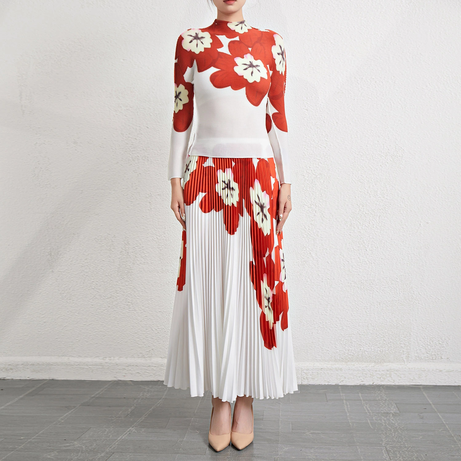 Plis Fabricant de vêtements Dernier ensemble plissé classique pour femmes Conception du fournisseur Ensemble imprimé plissé croisé Haut extensible élastique et jupe midi longue Ensemble 2 pièces 1