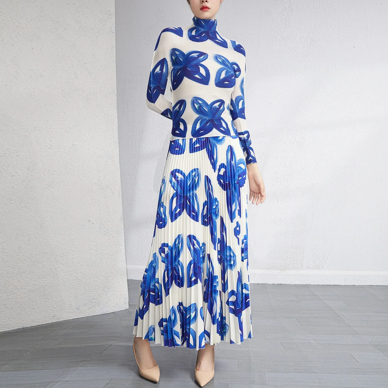 Hersteller von Plissee-Kleidung, schneller Versand, Miyake-Plisseerock-Sets, Großhandel für 2-teilige Damen-Outfits, elastisches Rollkragen-Langarmshirt, bedruckter langer Plisseerock-Lieferant 1