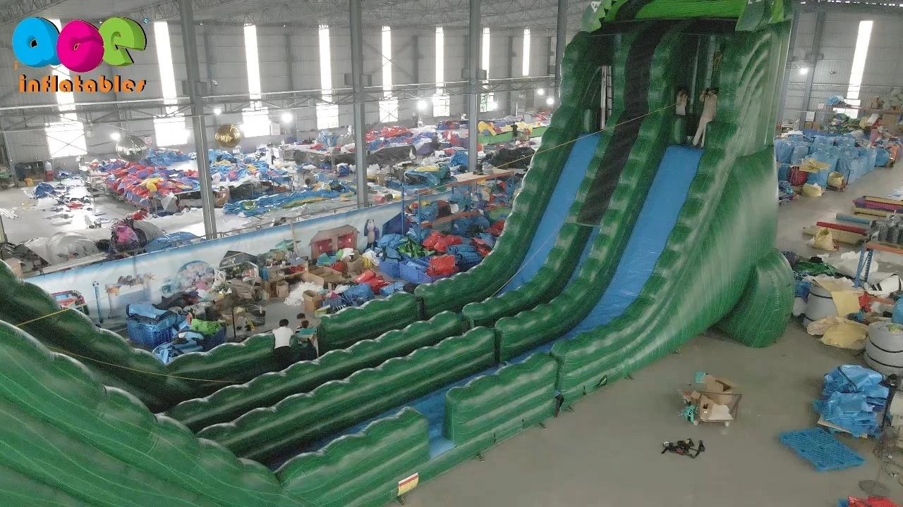 Tirolesa inflable comercial con tobogán gigante para divertirse 1