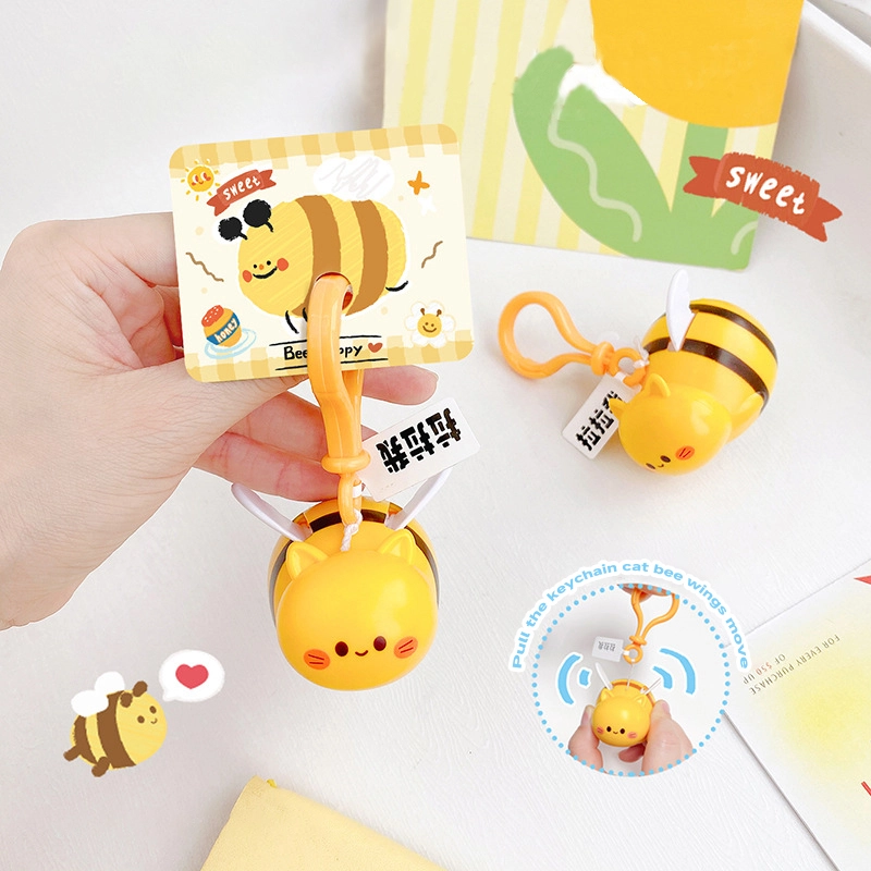 Creative pull wire bee fly ah fly doll cartoon cute schoolbag pendant car key chain decompression toys 1