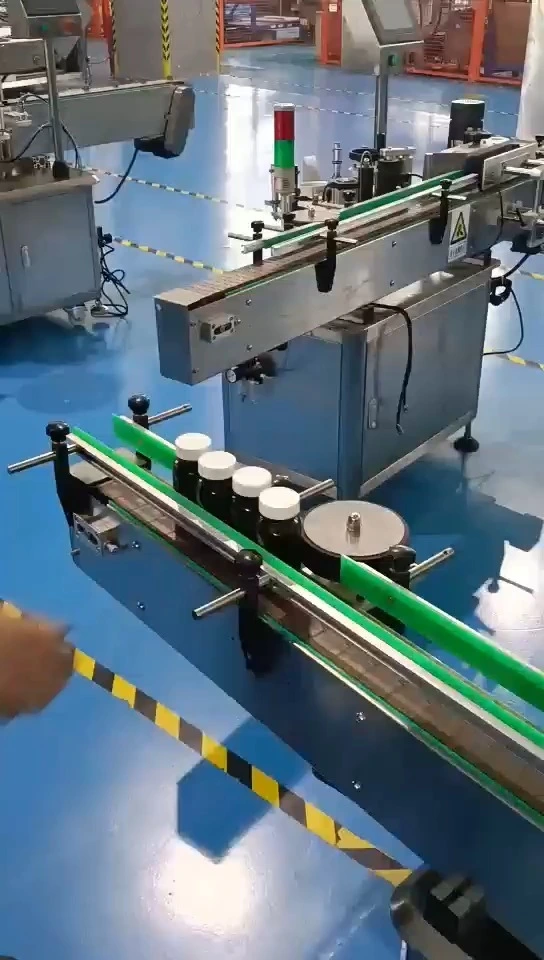 自動丸ボトル位置ラベル貼付機 1