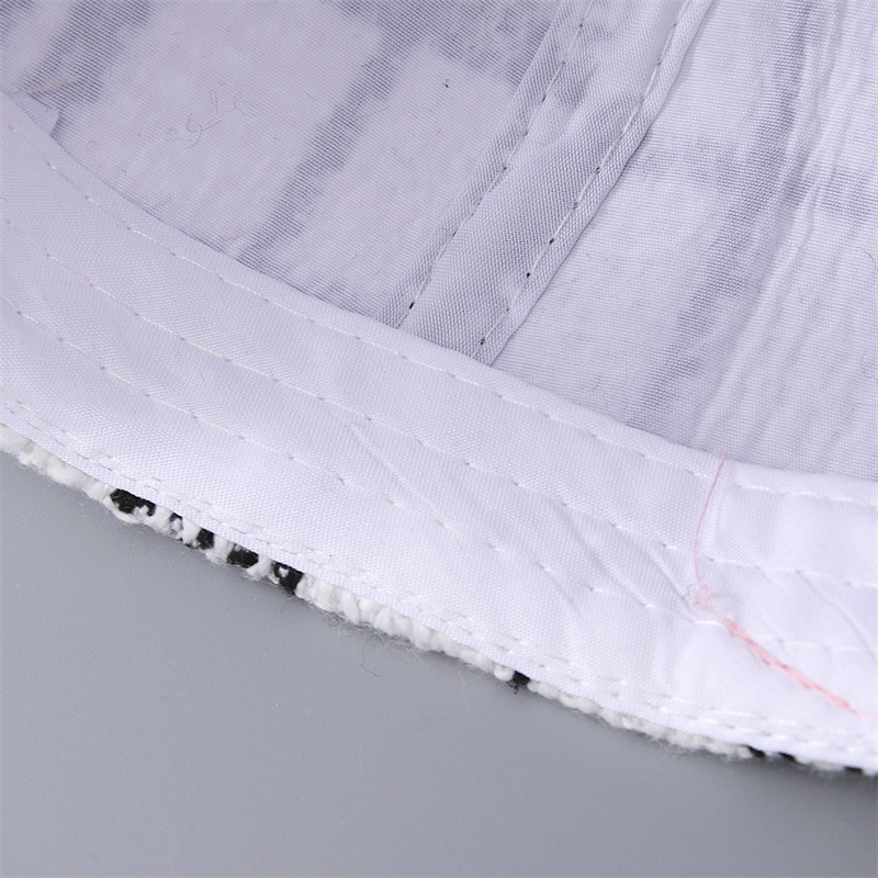 Close-up of the white inner band, lining and stitching inside the cap.