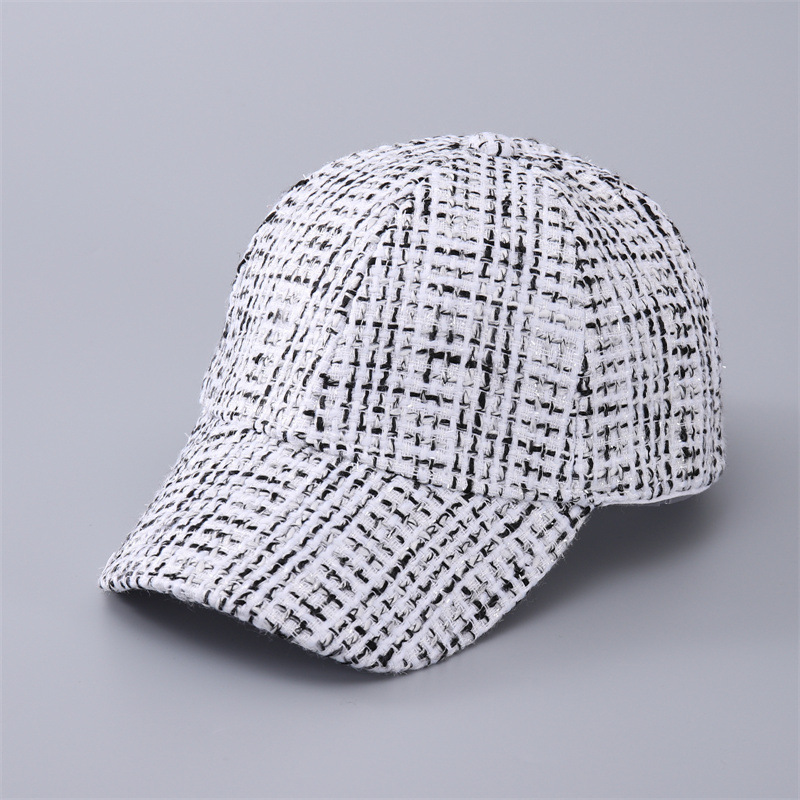 White baseball cap with a fine black check pattern, shown from the front at an angle.