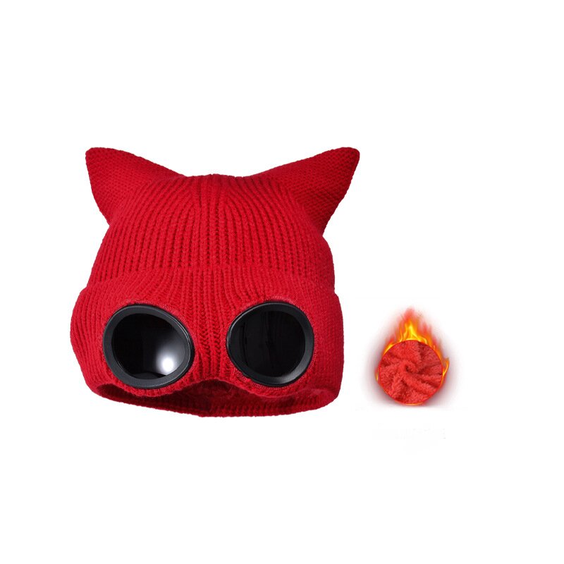 Red cat ear knit hat with round dark lenses and a small lining detail inset.