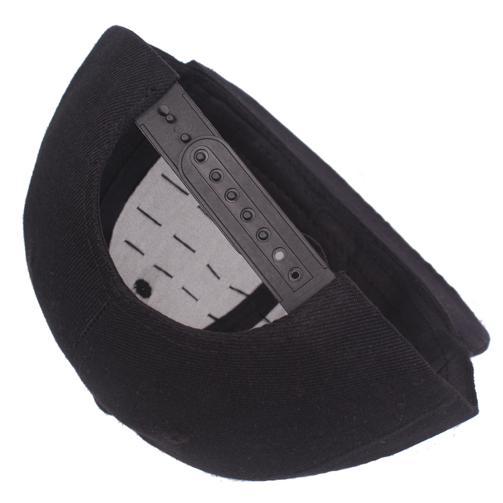 Inside view of a black cap showing the snapback strap and inner front panel.