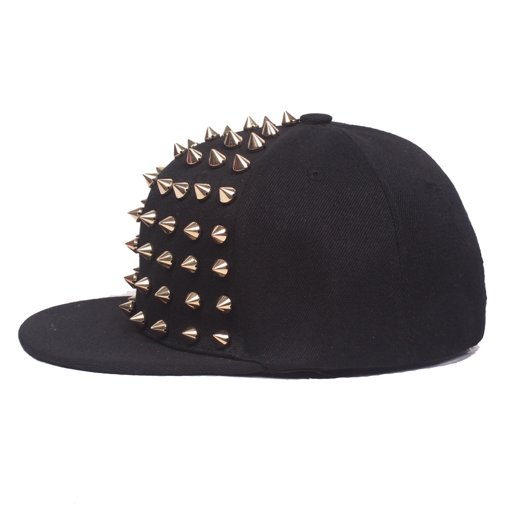 Side view of a black cap with gold-tone front studs and a flat brim.