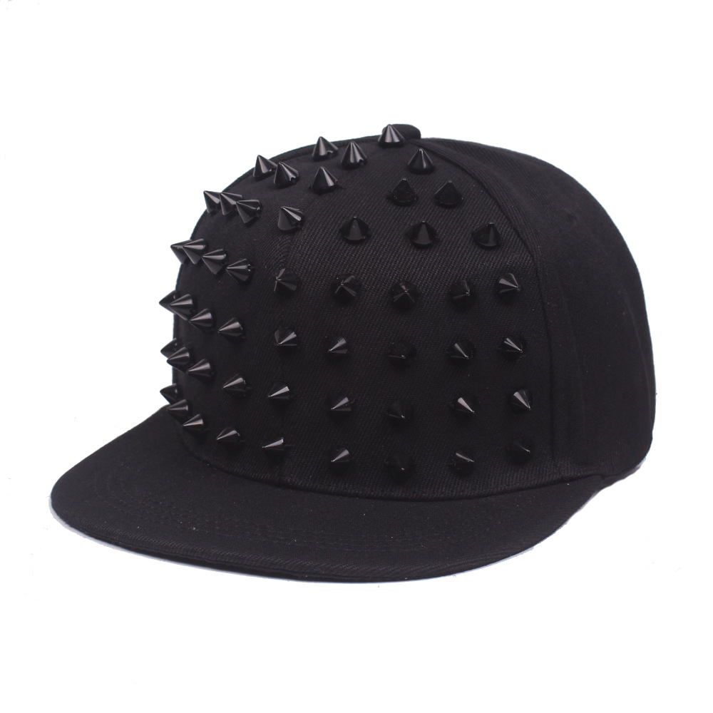 Black flat brim cap with matching black cone studs on the front.