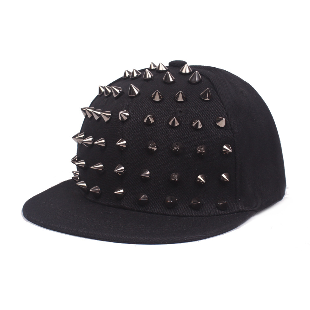 Black flat brim cap with silver-tone cone studs across the front panels.