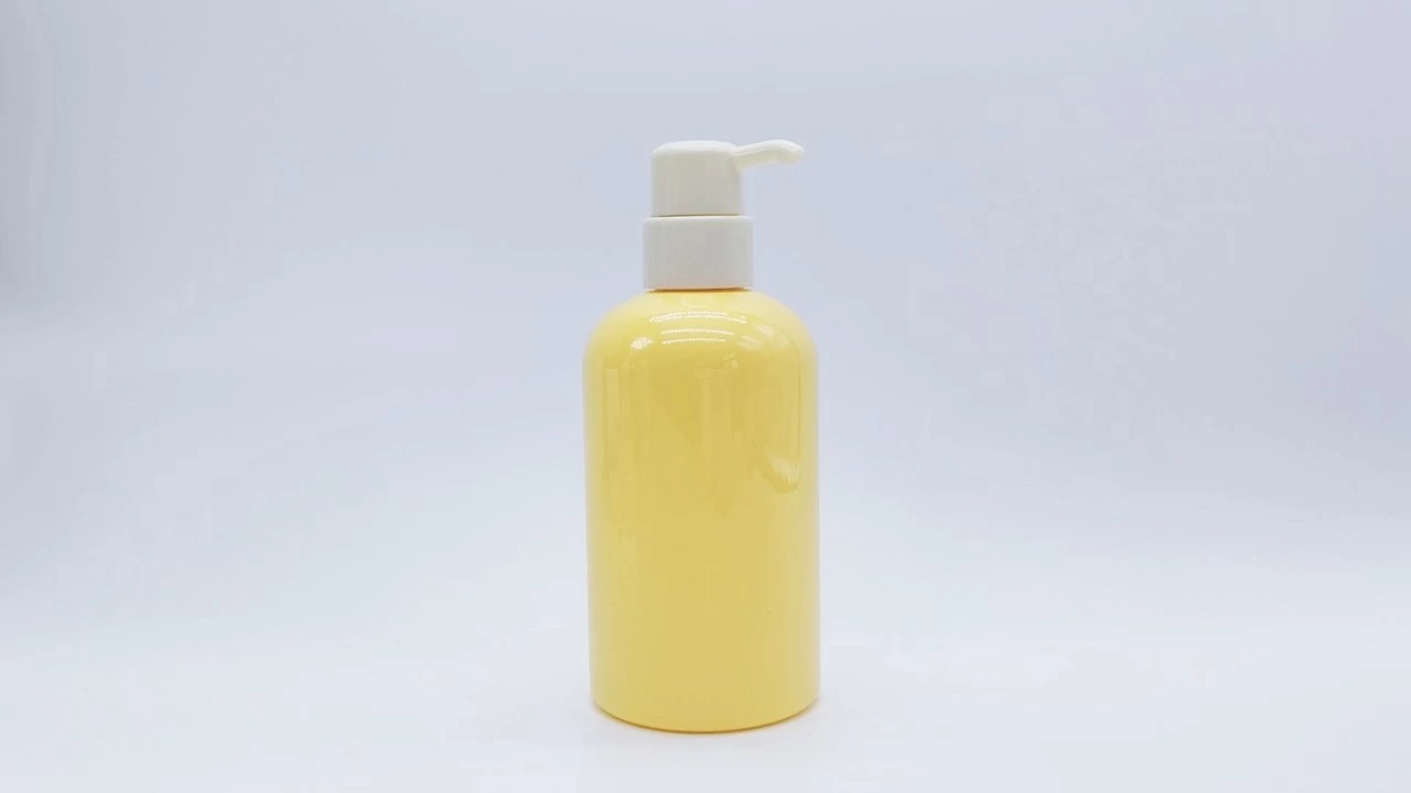 Glamorosa botella de loción corporal amarilla de PE/PET de 340 ml para el cuidado de la piel. 1