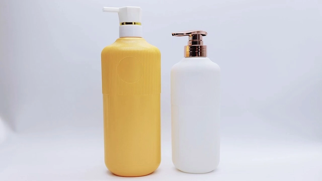 Botella de loción corporal glamurosa de PE/PET con rayas verticales naranjas y blancas de 500 ml/800 ml 1