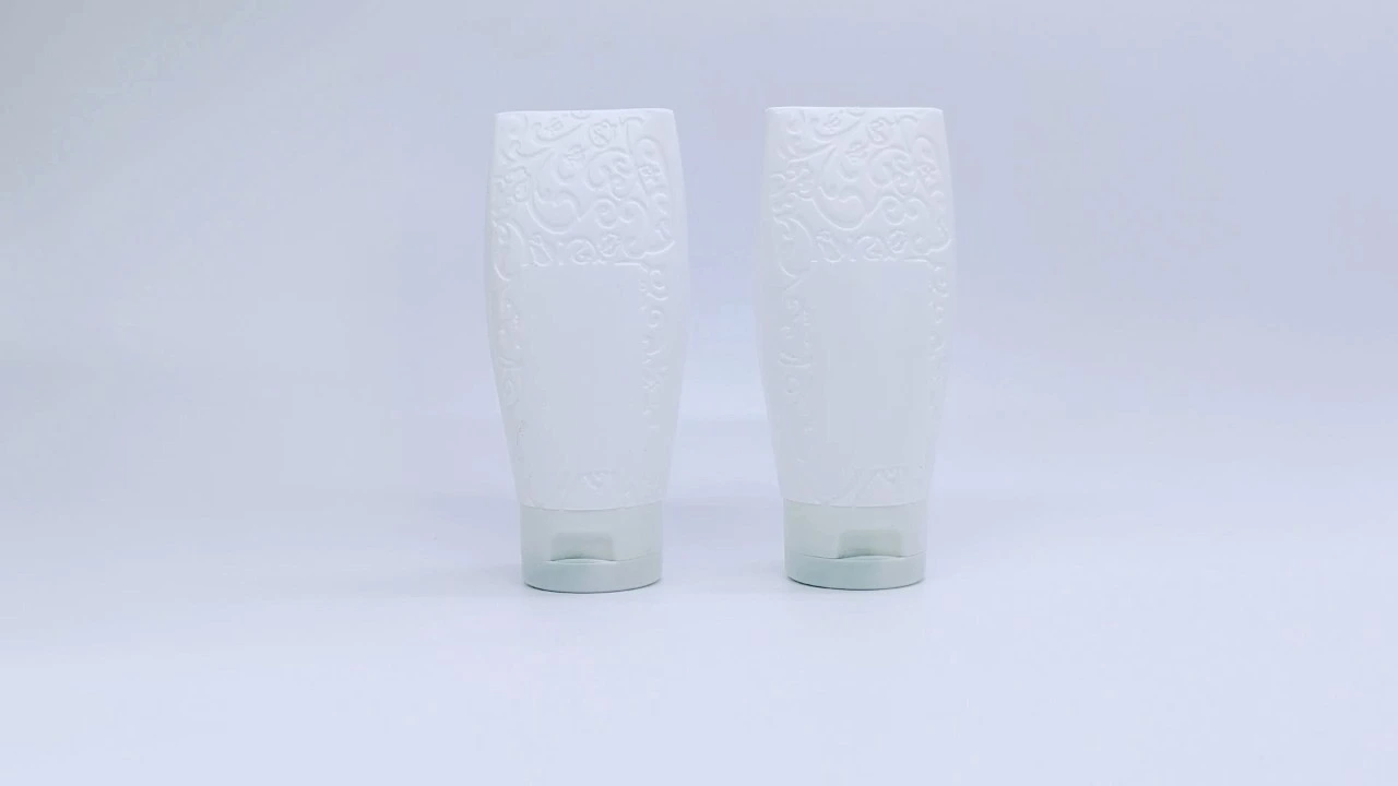 Glamorous 100ml white emboss PE squeeze lotion bottles 1