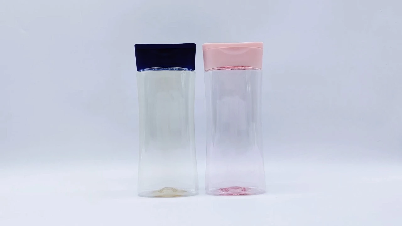 Botella de champú y acondicionador de PET transparente, de 220 ml, color azul/rosa, ideal para el cuidado de la piel. 1