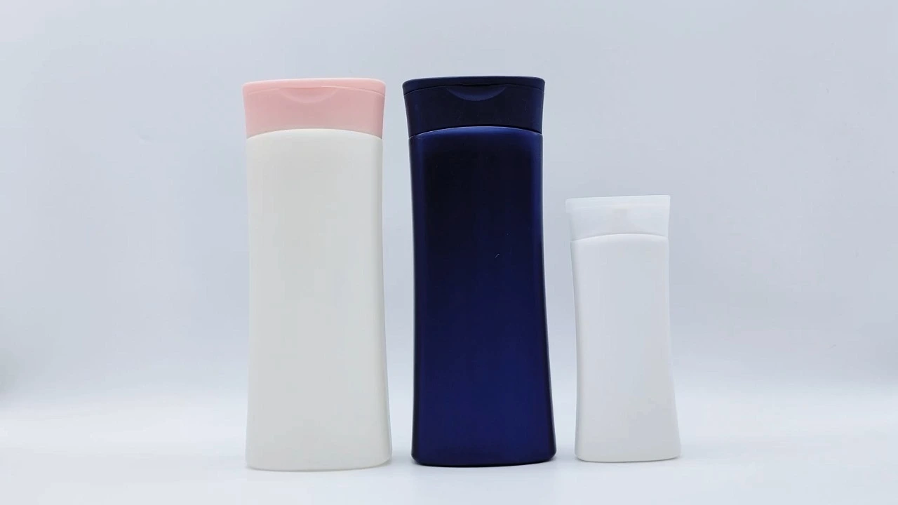 Botella glamurosa de champú y acondicionador de PE azul marino/blanco de 100 ml/400 ml para el cuidado de la piel. 1