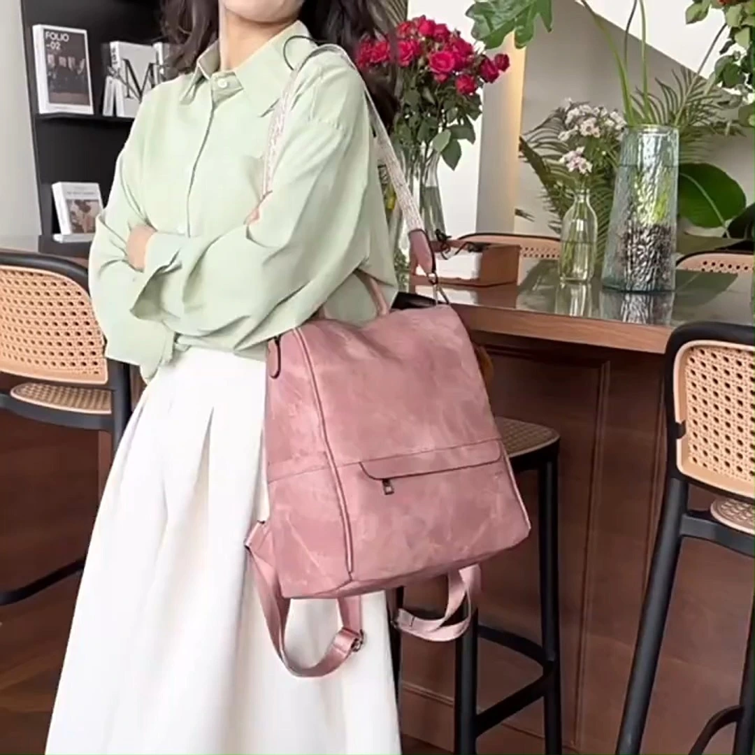 Mochila de viaje impermeable para mujeres de doble propósito de cuero PU. 1