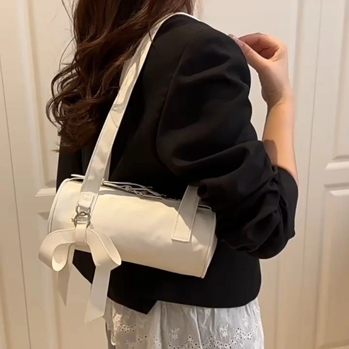 Bolso de arco a pequeña escala, nueva bolsa de cuerpo cruzado minimalista, bolsa de cilindro de axila moderna 1