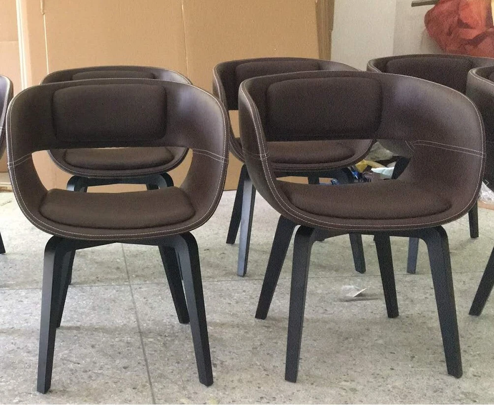 Nordic-style fiberglass dining chairs with low backs, featuring modern and simple design, suitable for home use in small spaces, providing comfortable seating for a compact dining area 1