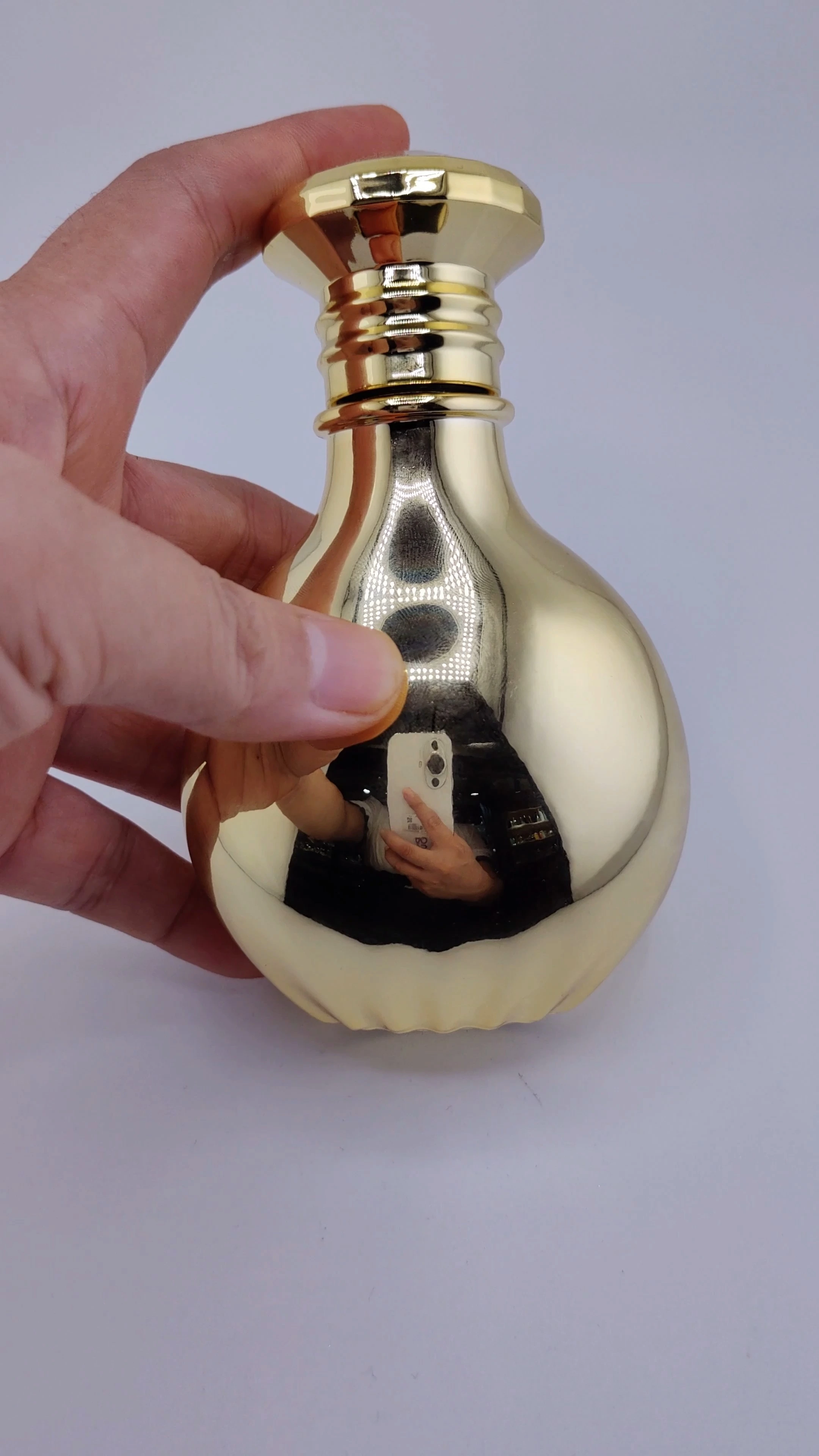 Botellas de perfume redondas doradas vacías con atomizador, de alta calidad, de 50 ml y 100 ml, con caja, venta al por mayor. 1