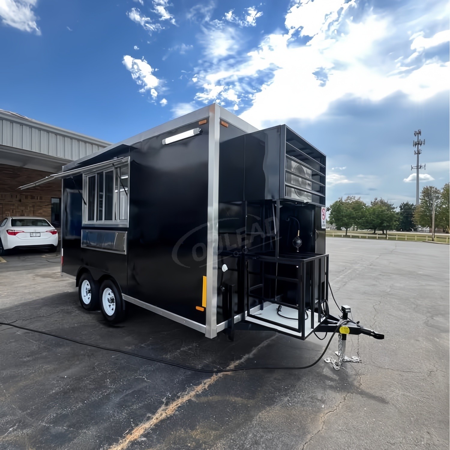Sleek Black Dual - Axle Food Trailer with Stainless Steel Serving Window 9
