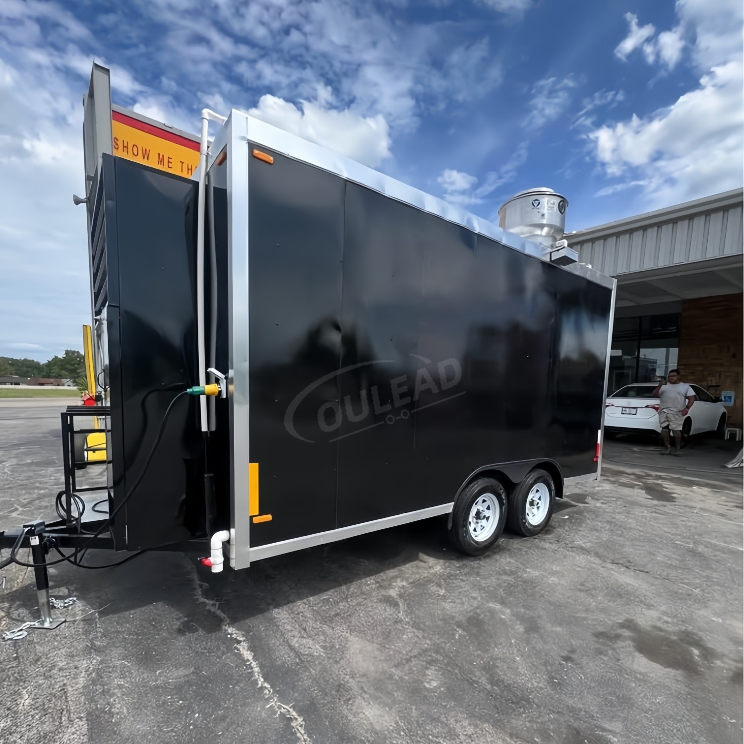 Sleek Black Dual - Axle Food Trailer with Stainless Steel Serving Window 7