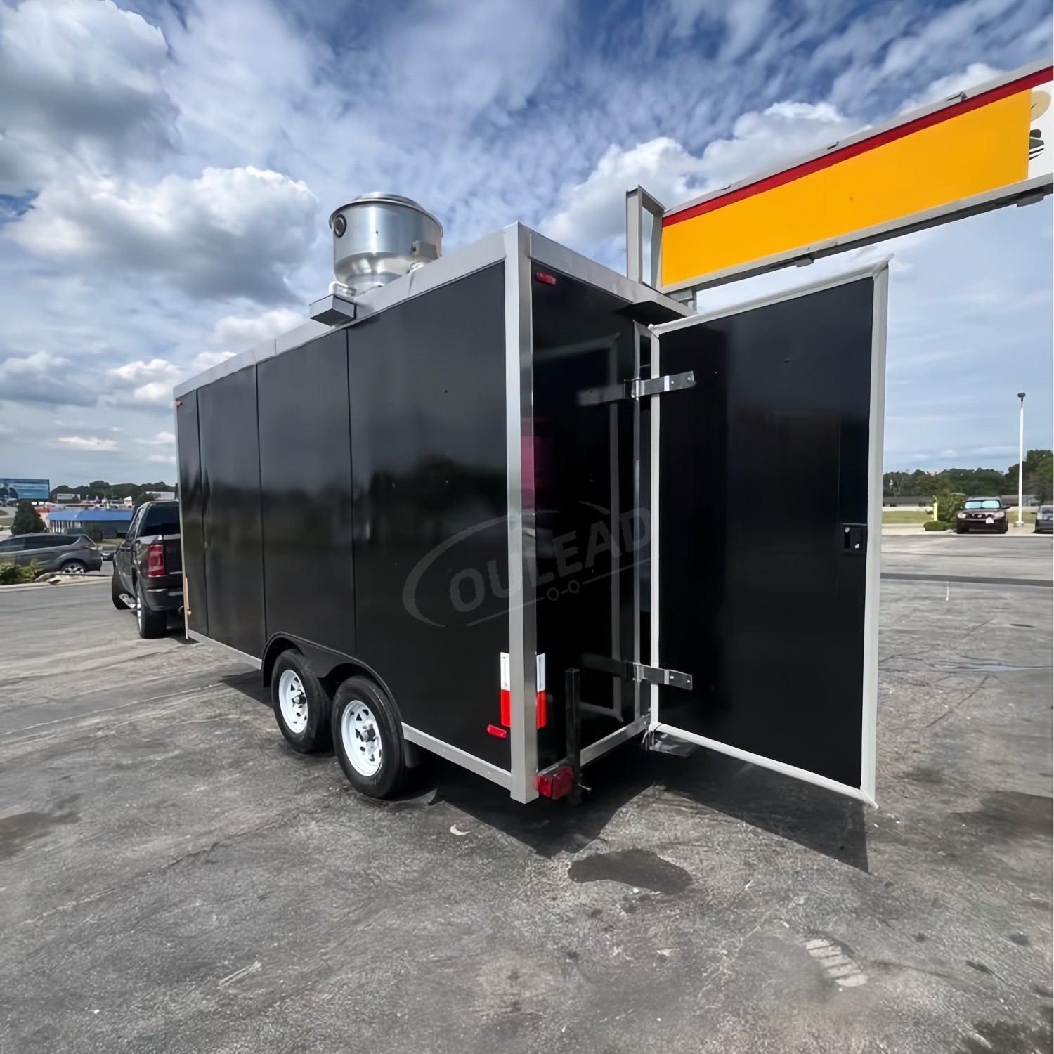 Sleek Black Dual - Axle Food Trailer with Stainless Steel Serving Window 4