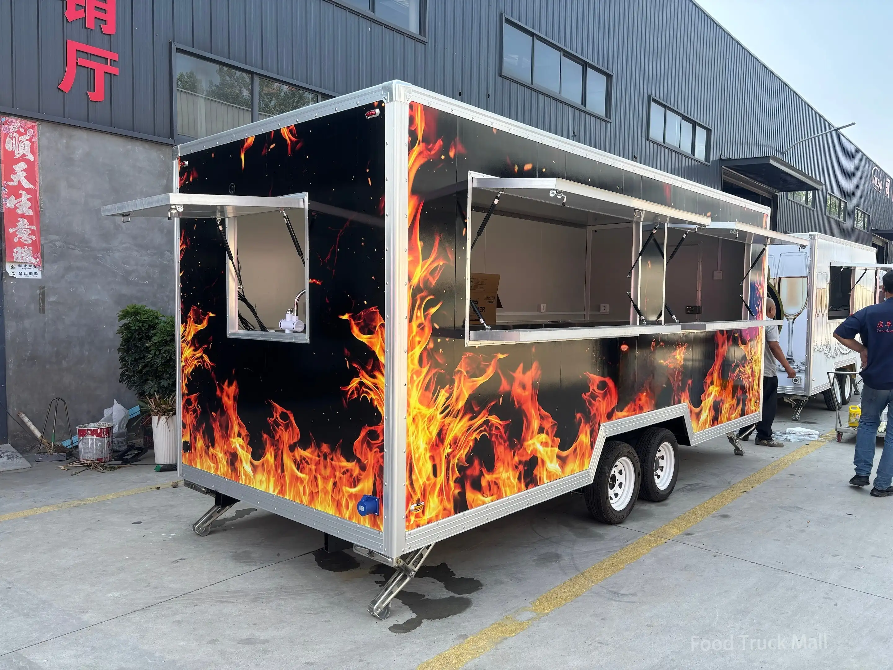 Dual - Axle Food Trailer with Bold Flame Graphic and Double Serving Windows 1