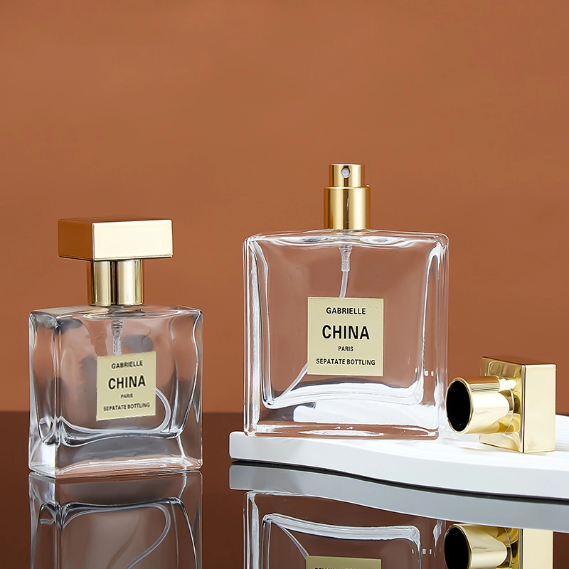 زجاجة عطر شفافة بغطاء مطلي بالذهب على شكل نجمة 1