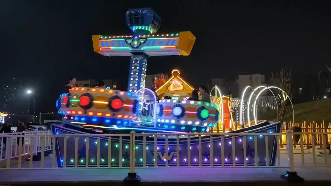 Four-Loop Swing Ship: Vibrant Themed Dynamic Amusement Ride 1