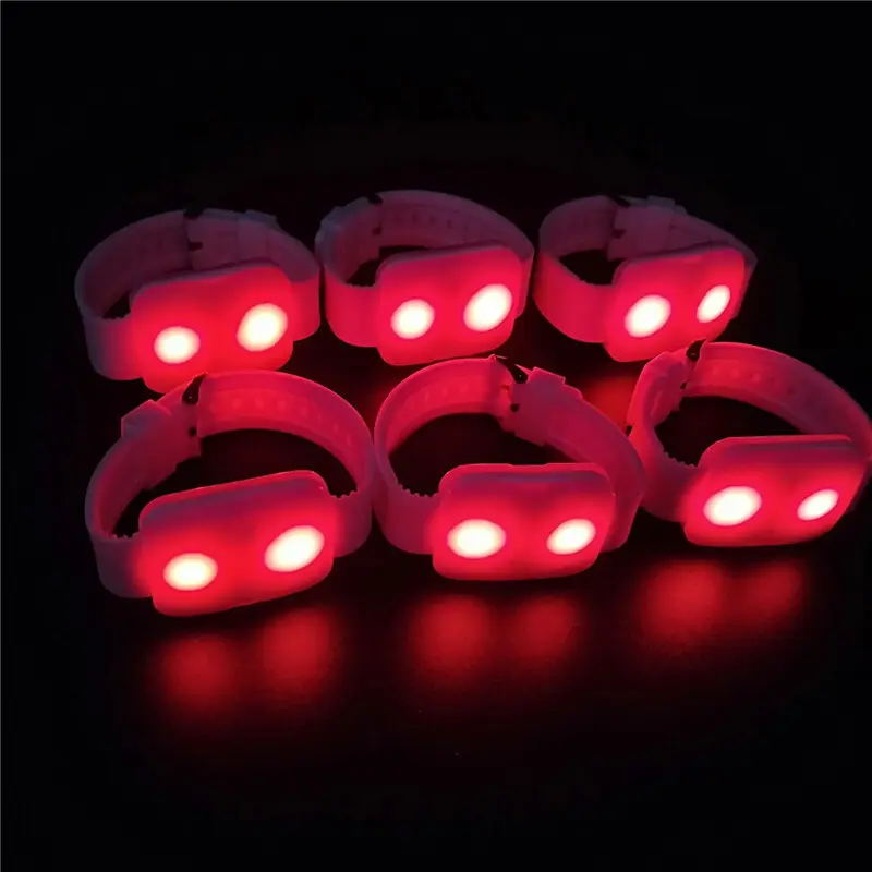 Red LED wristbands for synchronized audience lighting at events