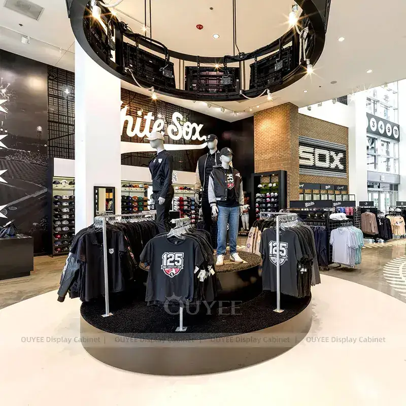 Custom Team Merchandise Store Fixture With Hat Wall And Circular Apparel Tower 1