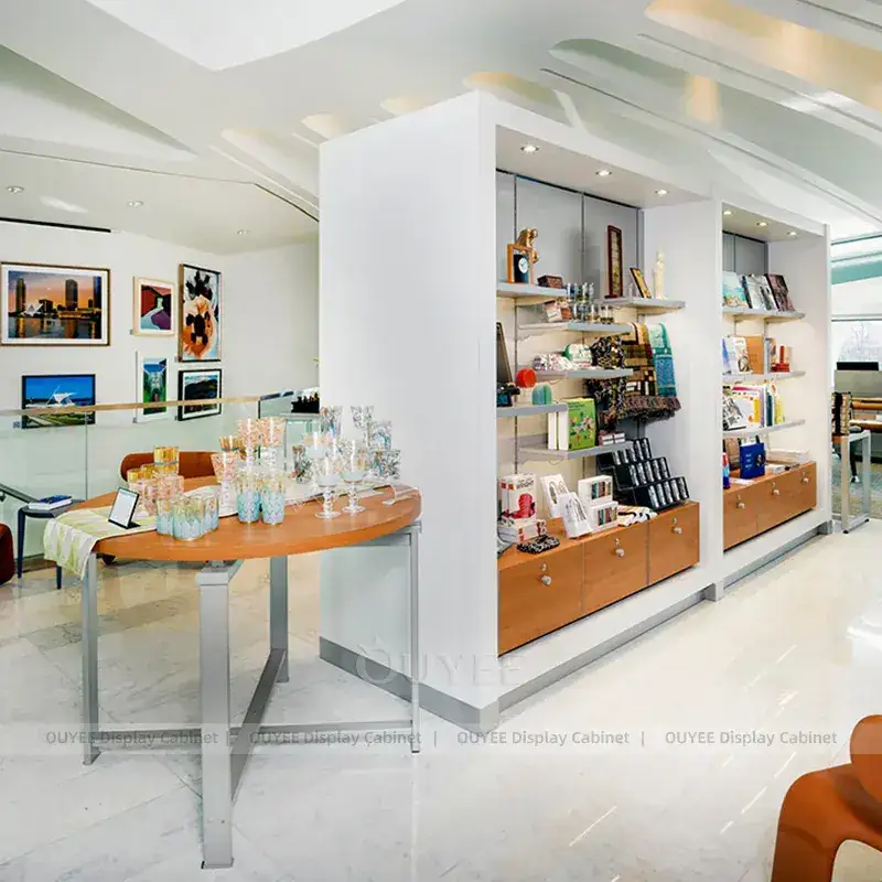 Minimal White Boutique Display Shelving With Built-In Wood Base Cabinet 1