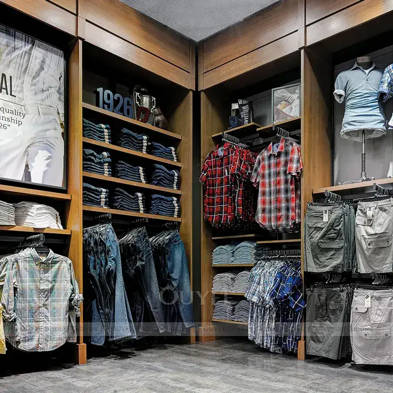 Classic Menswear Store Fixtures With Lounge Seating And Folded Apparel Shelving 1