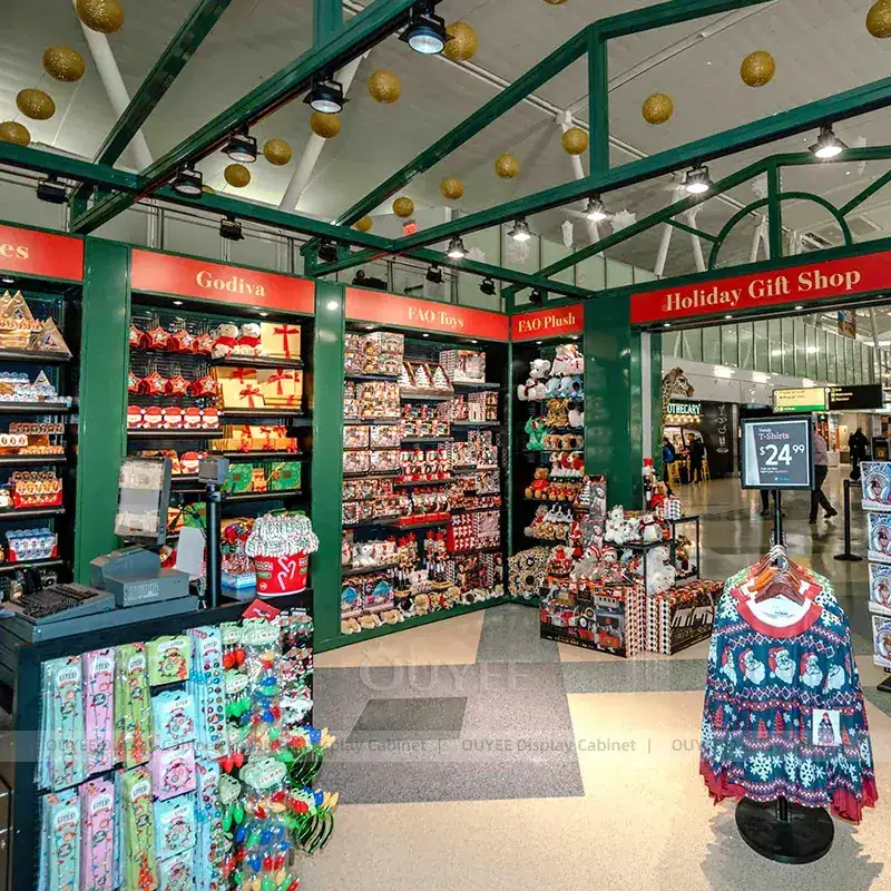 Holiday Gift Shop Fixtures With Green Framed Shelving And Seasonal Display Pods 1