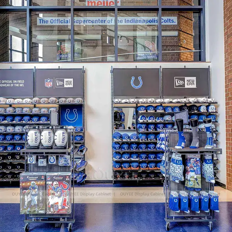 Blue Team Store Fixtures With Wall Graphic Displays And Accessory Towers 1