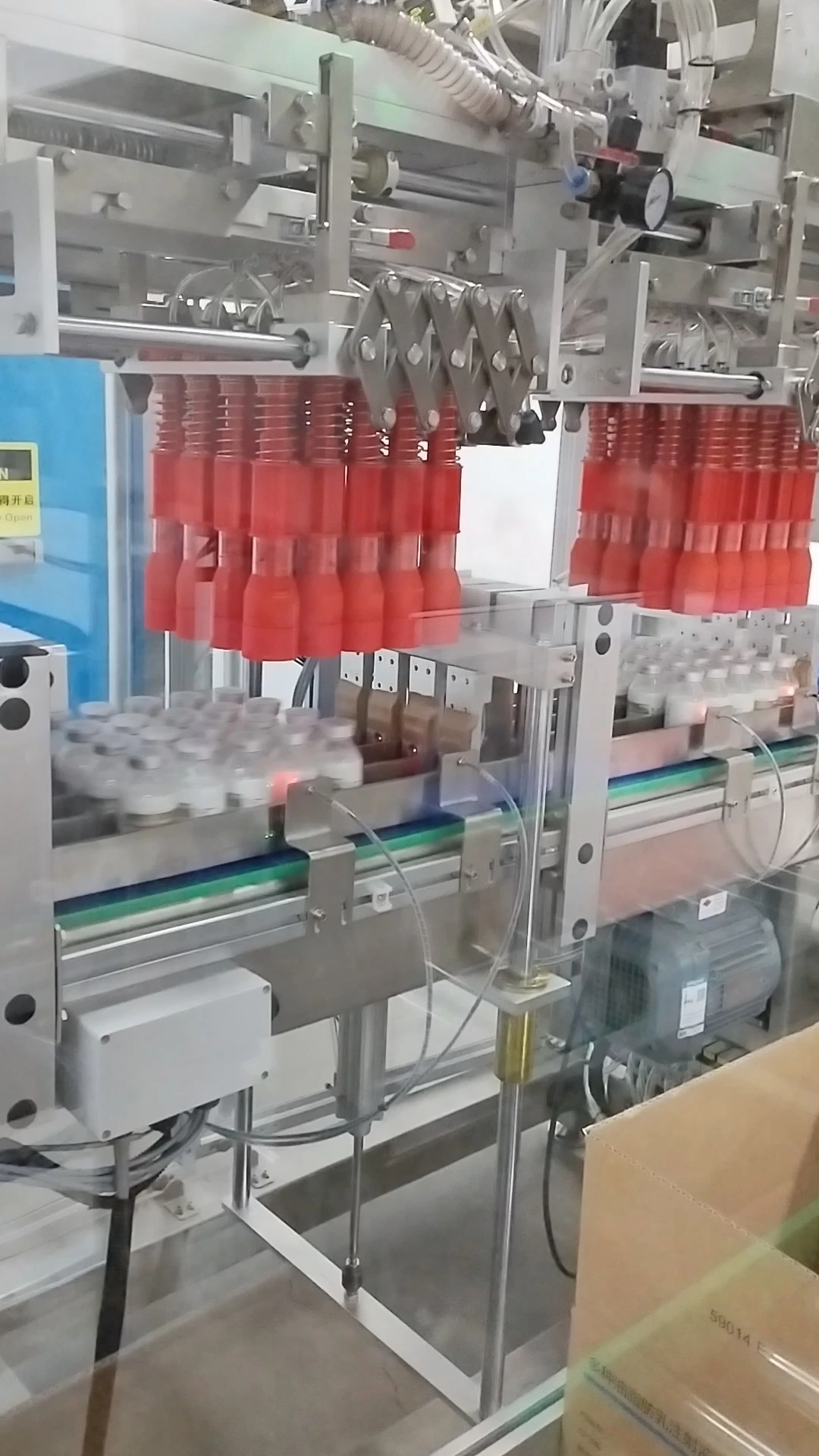 Confezionatrice automatica per flaconi rotondi per uso farmaceutico - Serie WKD-CZX (doppia testa) 1
