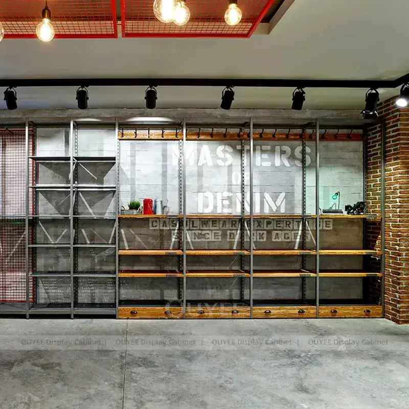 Industrial Denim Store Wall Fixtures With Long Shelving Runs And Display Tables 1