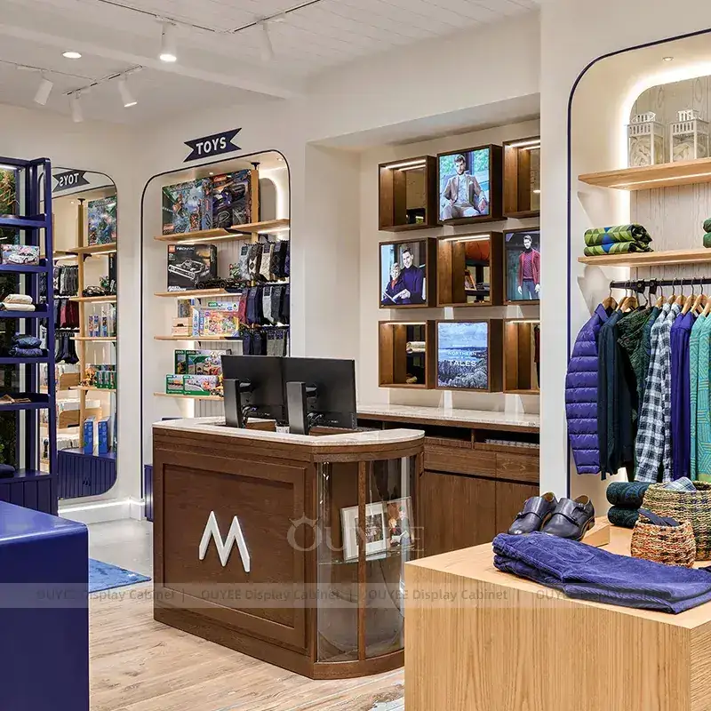 Premium Lifestyle Apparel Store Fixtures With Blue Cash Wrap And Feature Cabinet 1