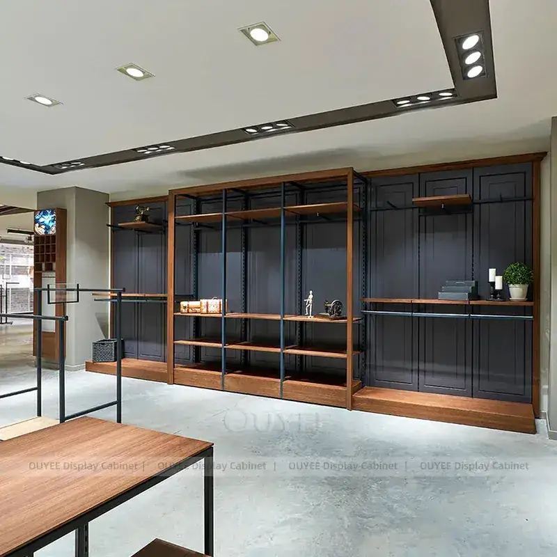 Mixed Modular Apparel Store Fixtures With Black Frame Walls And Open Tables 1