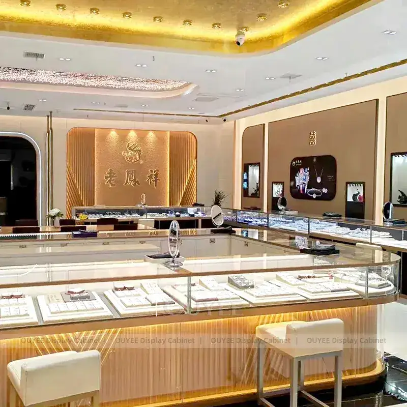 Refined Champagne Gold Jewelry Showroom Display Counter With Freestanding Glass Towers 1