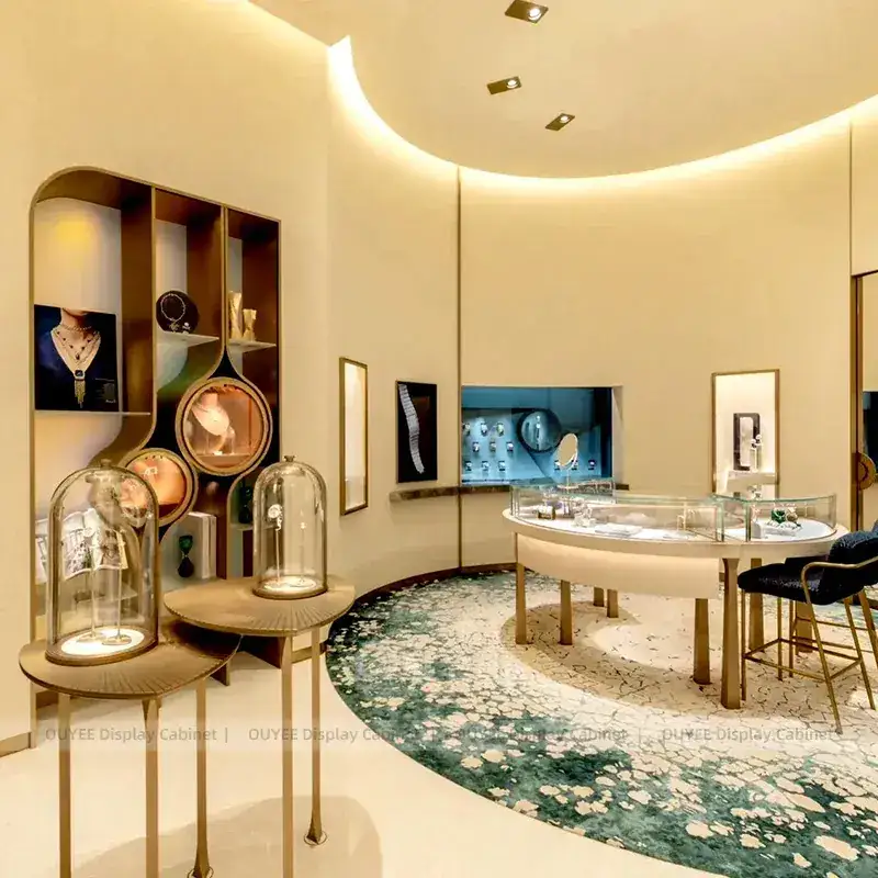 Sophisticated Beige Jewelry Store Display Table With Curved Glass Islands 1