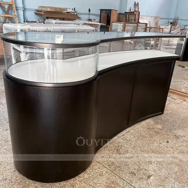 Sophisticated Champagne Gold Jewelry Store Display Table With Curved Glass Islands 1