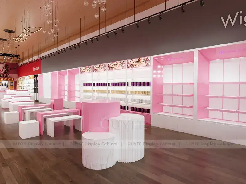 Negozio di parrucche rosa con tavolo espositivo centrale rotondo 1
