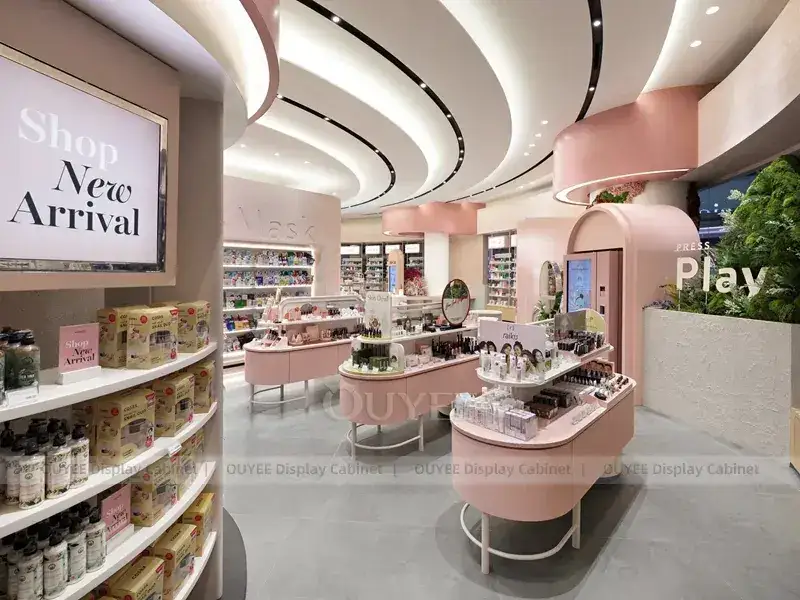 Arredamento per negozi di bellezza Socolla con espositori a isola rosa 1
