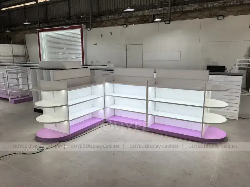 Bancone per cosmetici illuminato, bianco e viola, con estremità curve. 1