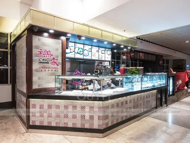 Schwarzer Bubble-Tea-Kiosk mit Glasvitrine und rosa Beleuchtung 1