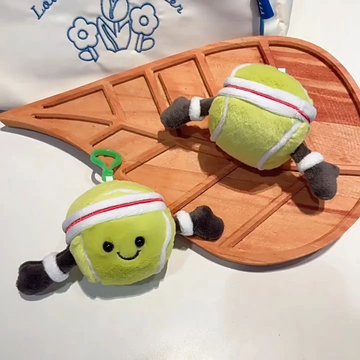 Llavero de peluche con forma de pelota de tenis sonriente 1