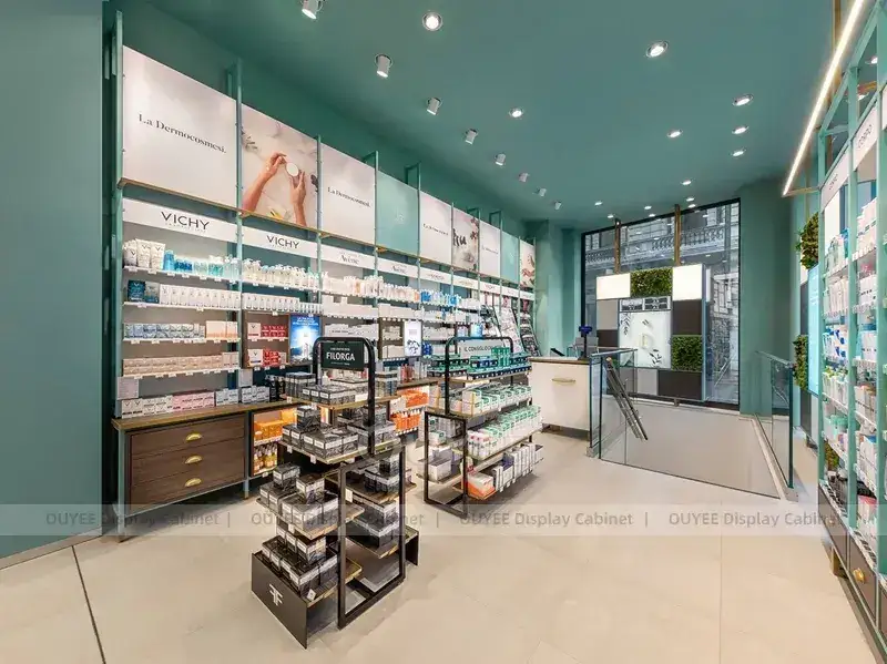 Rayonnages de pharmacie bleu sarcelle avec présentoirs gondoles en métal noir 1